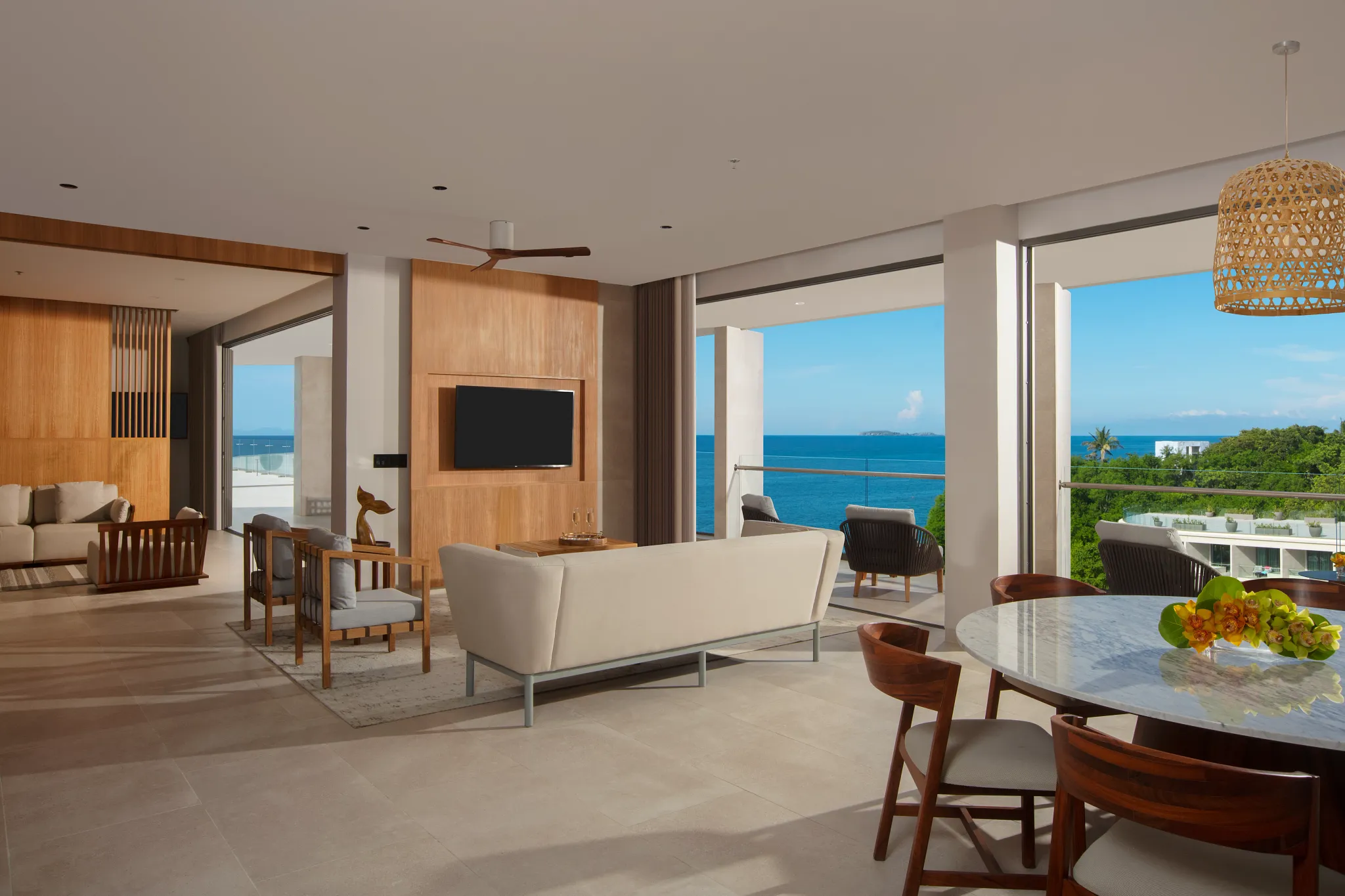Presidential Suite living area with ocean view terrace at Dreams Bahia Mita Resort.