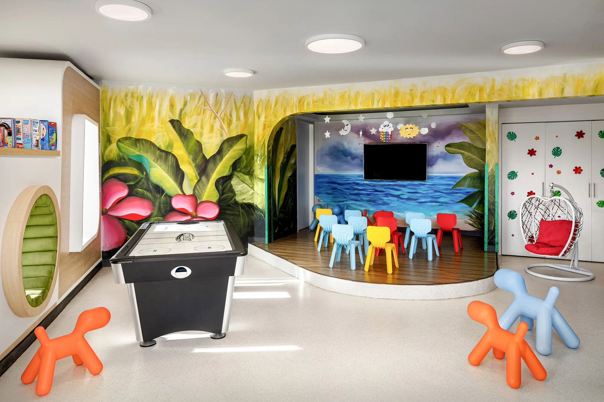 Bright and colorful kids club playroom with games and seating at Dreams Bahia Mita, ideal for supervised children’s activities.