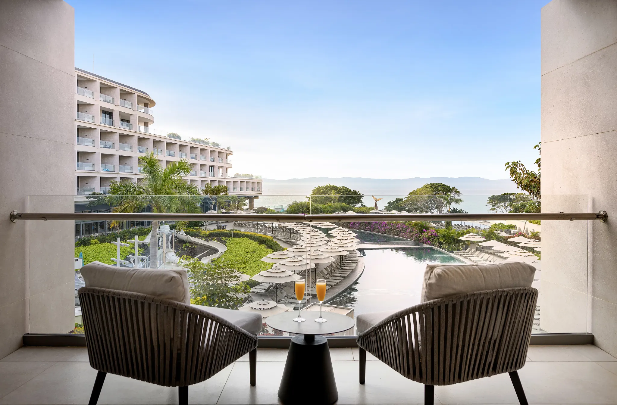 Junior Suite Ocean Front private balcony with ocean and pool views at Dreams Bahia Mita Surf & Spa Resort.