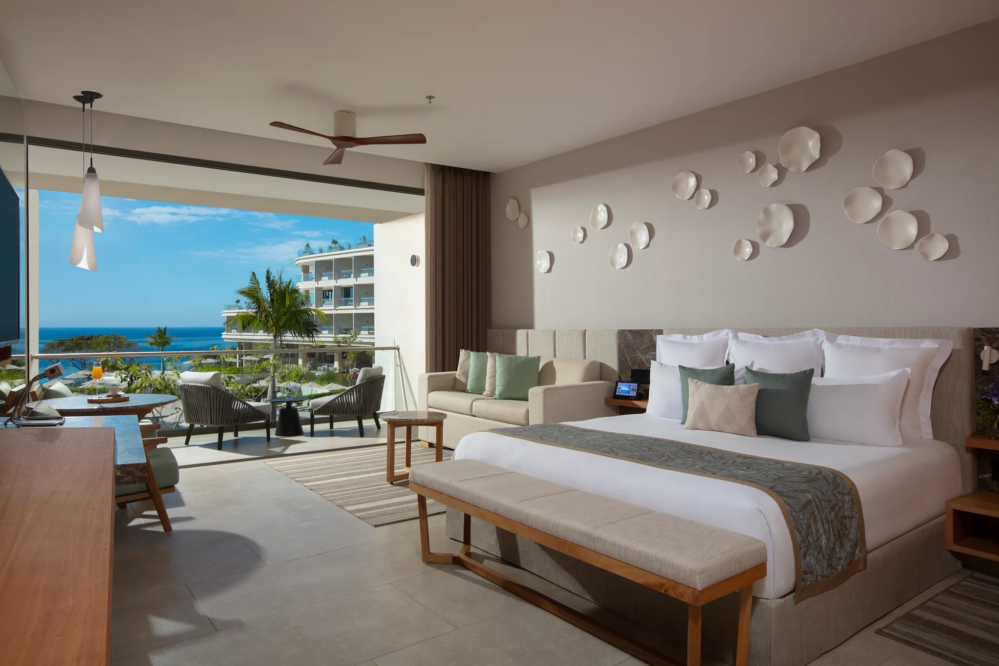 Junior Suite Ocean Front with king bed and balcony access at Dreams Bahia Mita Surf & Spa Resort.
