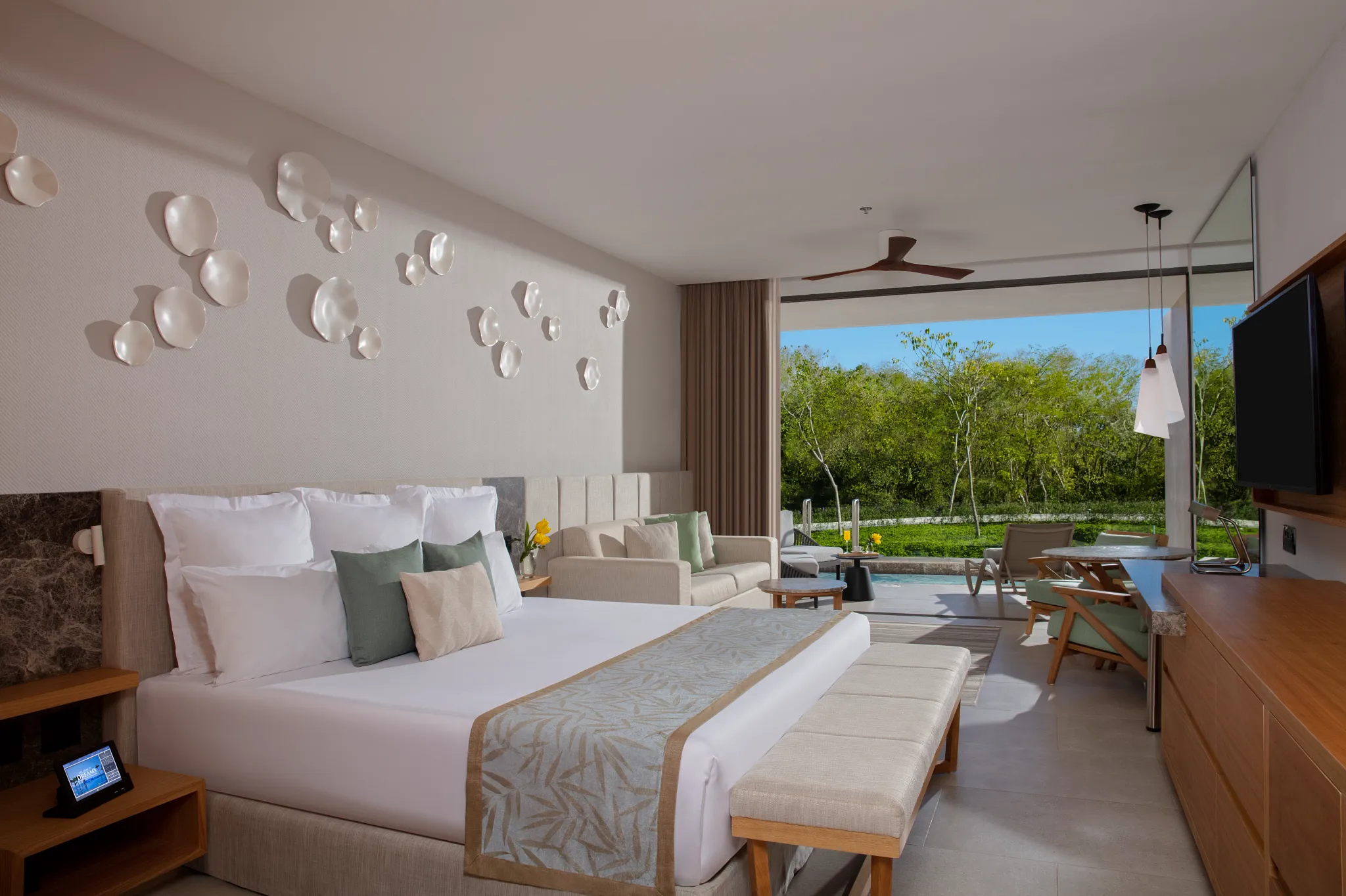 Junior Suite Tropical Swim Out with king bed and terrace access at Dreams Bahia Mita Surf & Spa Resort.