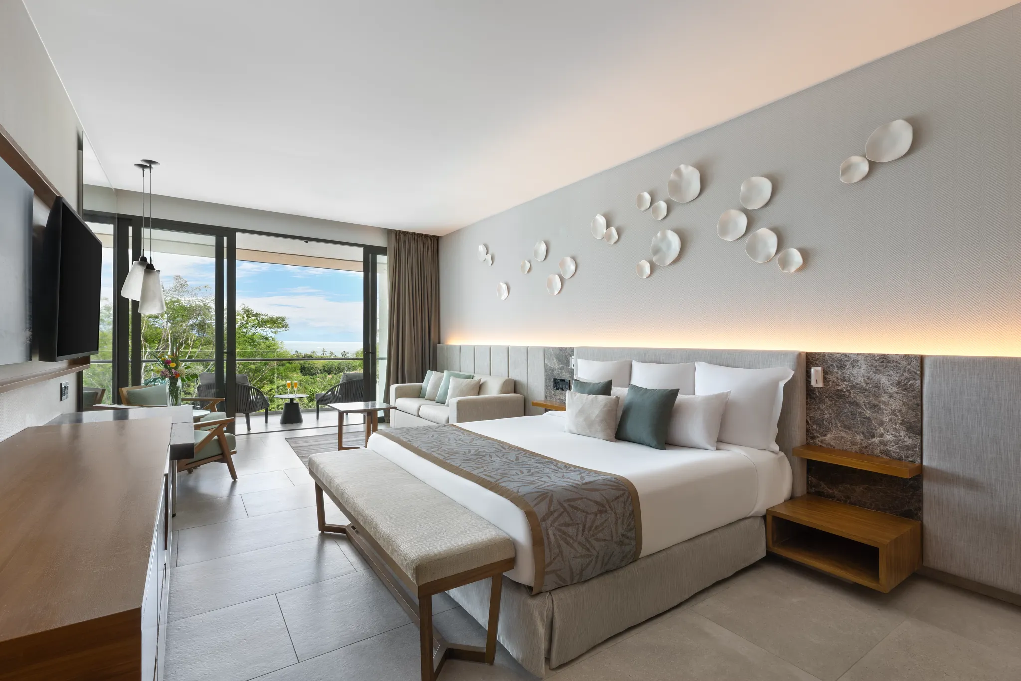 Junior Suite Waterpark View with king bed and balcony at Dreams Bahia Mita Surf & Spa Resort.