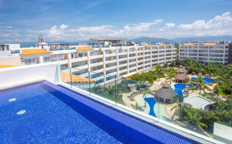 Marival Distinct Luxury Residences beachfront luxury resort with upscale suites and pools in Nuevo Vallarta, Mexico.