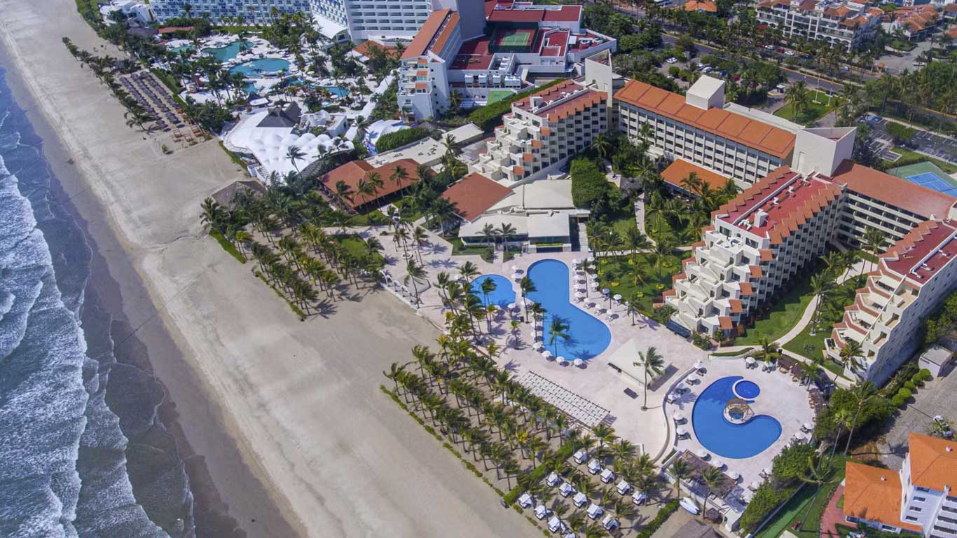 Occidental Nuevo Vallarta all-inclusive beachfront resort with pools and tropical landscaping in Riviera Nayarit.