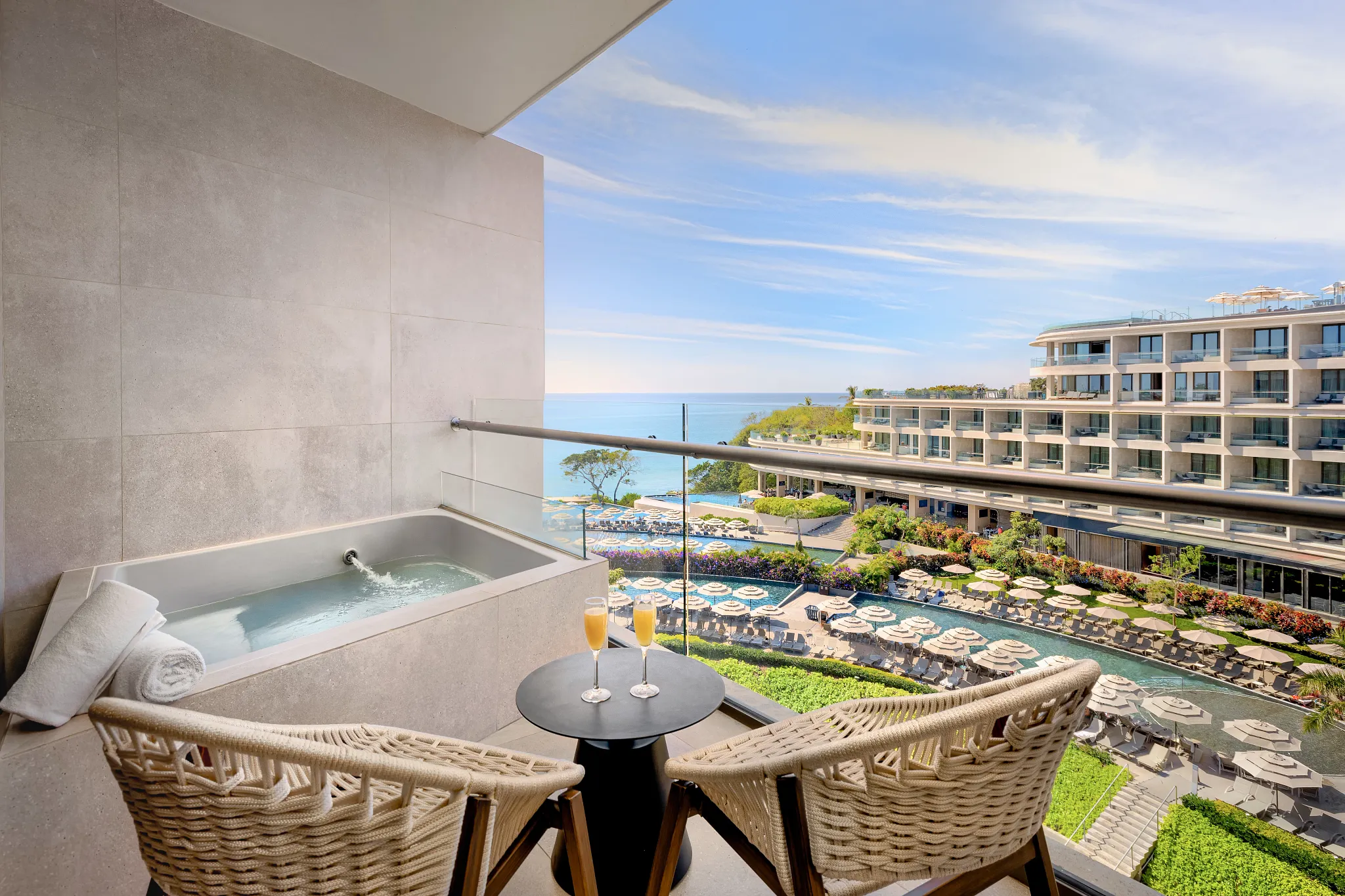 Preferred Club Ambition Suite Panoramic View terrace with outdoor soaking tub and ocean view at Dreams Bahia Mita Resort.
