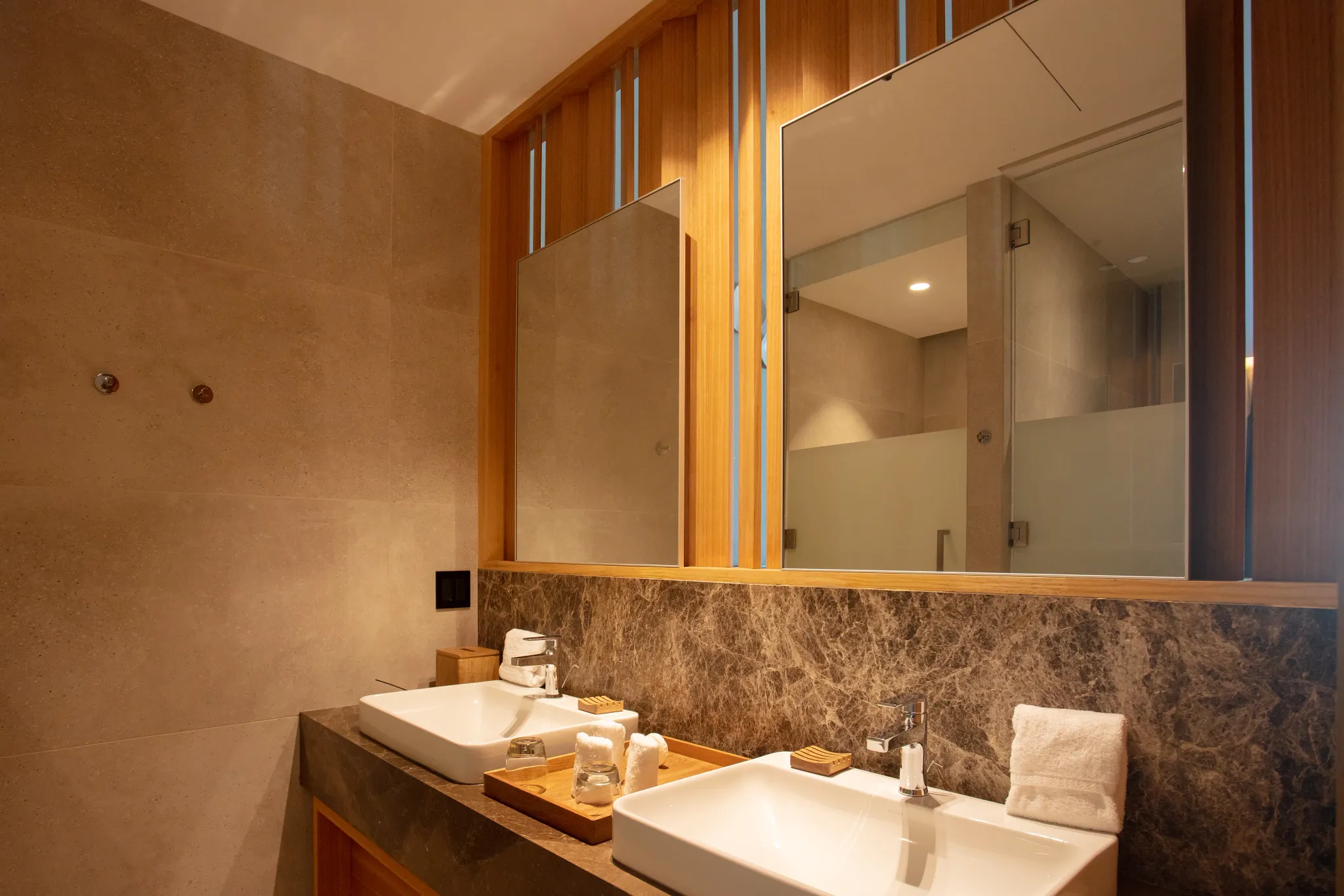 Preferred Club Junior Suite Partial Ocean View bathroom with double vanity and modern finishes at Dreams Bahia Mita Resort.