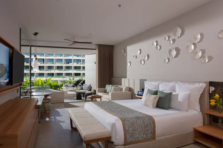 Preferred Club Junior Suite Sun Deck with king bed, seating area, and private terrace at Dreams Bahia Mita Resort.