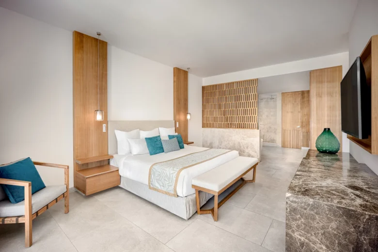 Preferred Club Master Suite Tropical View Swim Out king bedroom at Dreams Bahia Mita Resort.