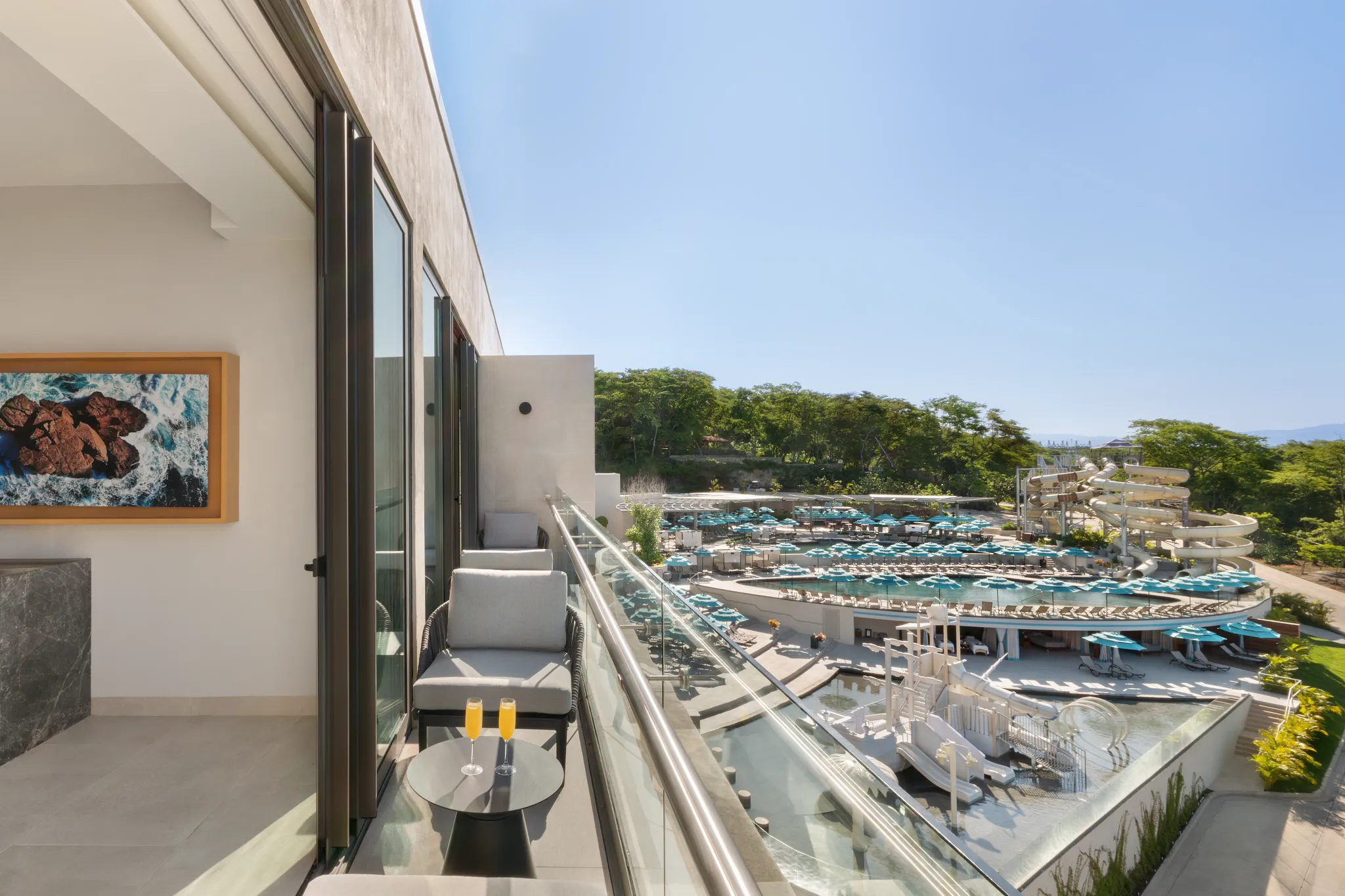 Preferred Club Master Suite Waterpark View balcony overlooking pools and slides at Dreams Bahia Mita Resort.