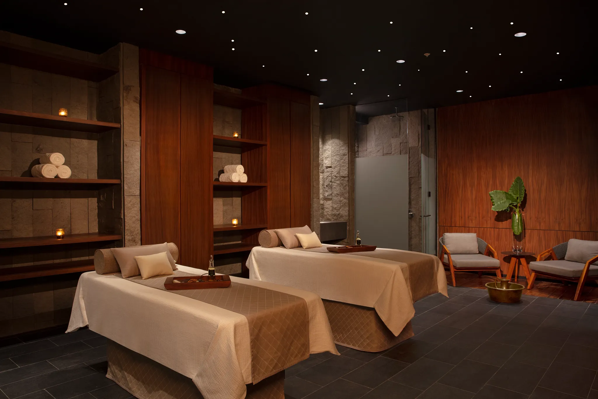 Spa treatment room with massage beds and soft lighting at Dreams Bahia Mita.